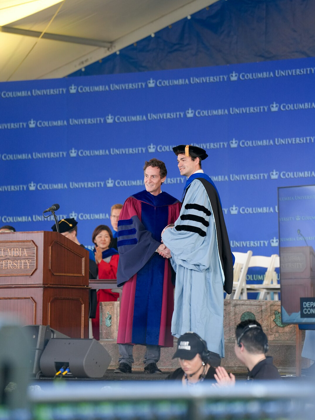 Graduate shaking hands after a television career workshop